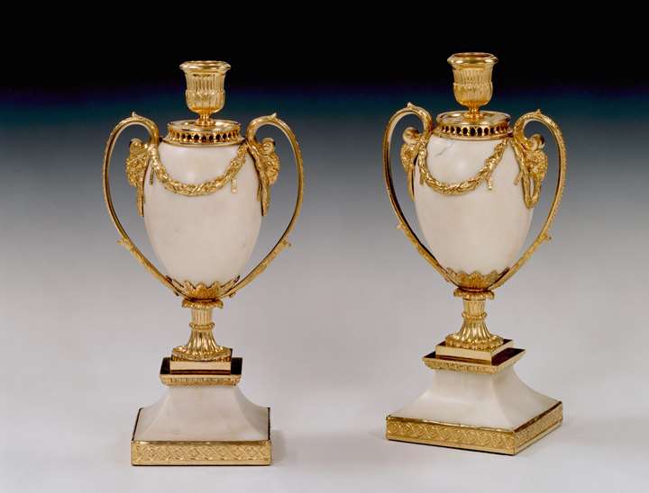 A pair of George III white marble candle vases